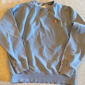 Unisex Blue Crewneck Wrangler Sweatshirt with Wrangler logo in rainbow colors